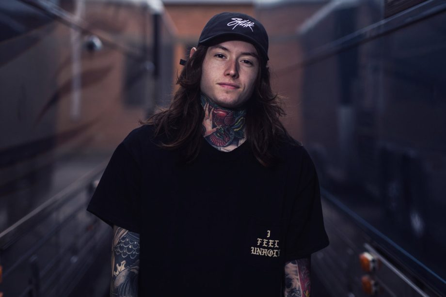 noah sebastian of bad omens photoshoot by bryan kirks wearing black tshirt and cap 920x613 1 - Wilbur Soot Merch